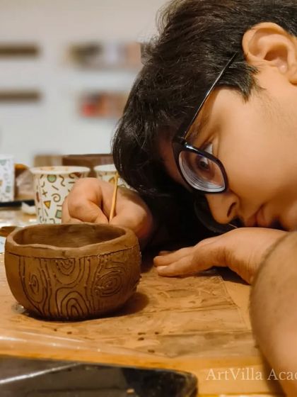 The look of deep concentration. This young participant is getting up close to add fine details to his bowl during our workshop at Doolally Taproom.