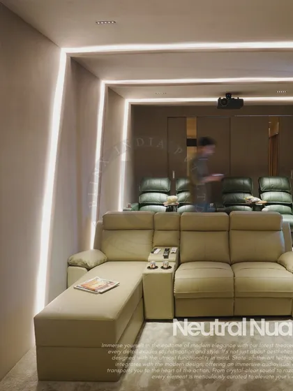 This wide view of our Noida project highlights the multi-level seating arrangement, with a chaise lounge sofa in the front row and tiered recliners behind. The clean lines of the integrated LED lighting accentuate the room's modern architecture and create a captivating environment.