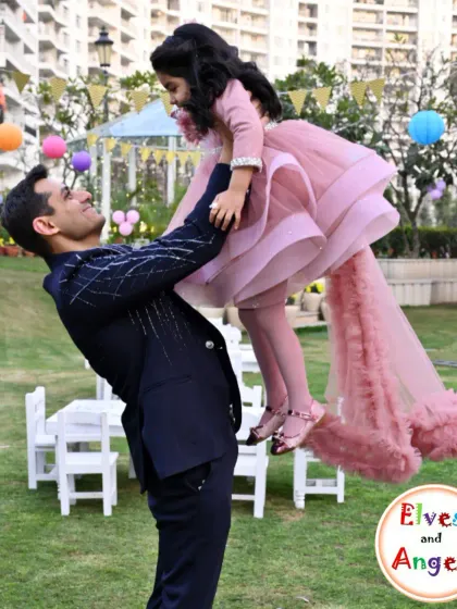 A heartwarming moment between a father and daughter at an outdoor party. My goal is to create a beautiful setting for families to make lasting memories.