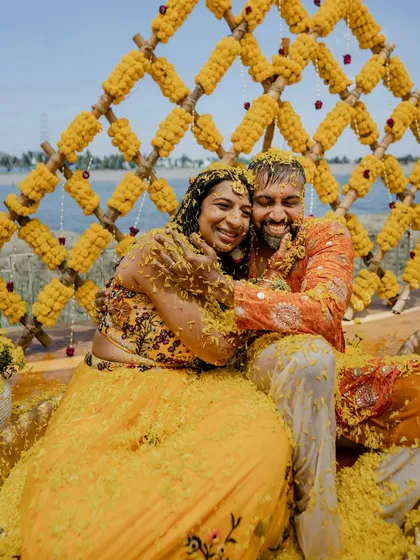 The pure, unadulterated joy of a Haldi ceremony. We love capturing the energy when families come together for this vibrant ritual, like this unforgettable moment from Sparsha and Karthik's lakeside celebration.