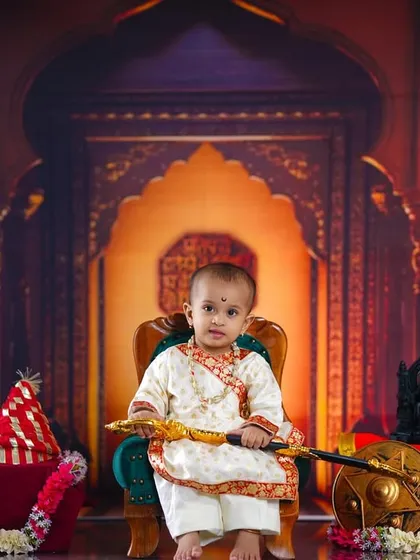 A full view of our grand Shivaji Maharaj setup, where this little king sits on his throne, surrounded by a shield, sword, and other royal props.