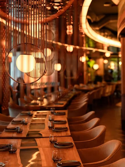 I wanted to create a space that feels both celebratory and comfortable. Here, warm wood, soft, glowing lights, and carefully chosen details come together to create an atmosphere that invites you to settle in and stay awhile.