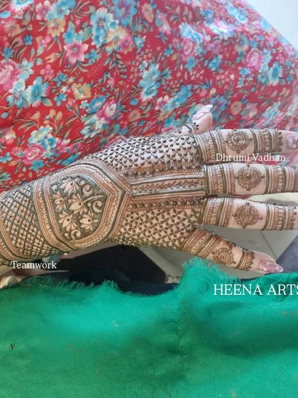 A unique hexagonal pattern on the back of the hand, filled with delicate floral details.