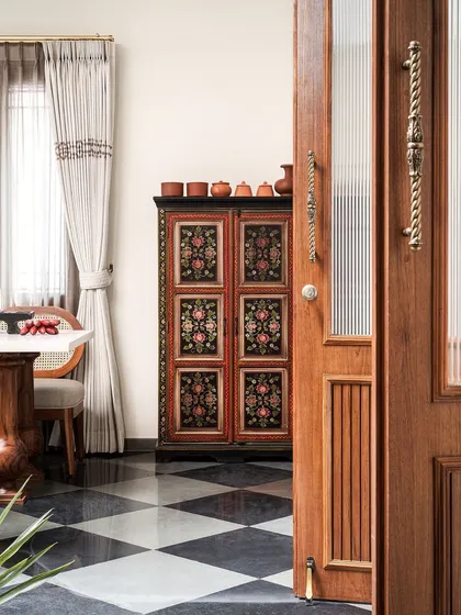 We stumbled upon this hand-painted antique cabinet on a sourcing trip to Kochi. It was lying in a corner, all dusty, just waiting to be discovered. We had it refurbished, and now it stands as the prettiest vintage crockery cabinet in the dining space.