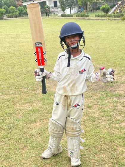 A young champion from our U-10 team, fully padded up and ready for battle. His determined expression shows the fighting spirit we instill in our players.