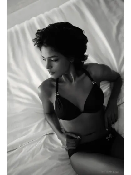 The absolutely unreal raw beauty of Nikita Sahay. This black and white boudoir shot is all about texture, mood, and quiet sensuality.