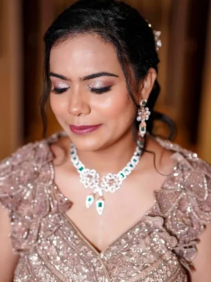 A close-up of the sangeet glam. You can see the detail in the metallic eyeshadow and the perfectly blended base that gives her skin a radiant, healthy glow.