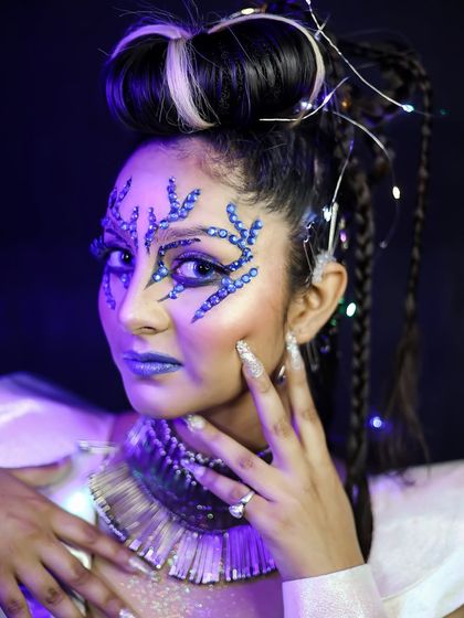 A close-up of the crystal makeup, highlighting the intricate details and use of fairy lights.
