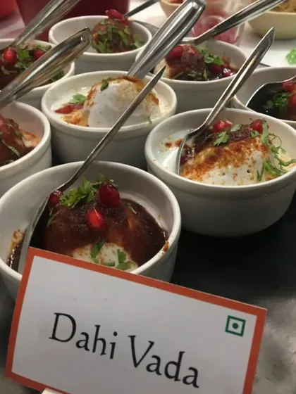 A closer look at our perfectly prepared Dahi Vada. Each bowl is individually portioned, chilled, and garnished with spices and pomegranate seeds, making it a convenient and delicious choice for any event menu.