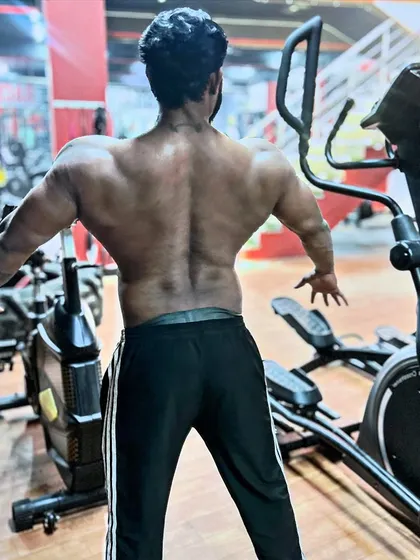 All it takes is one small step. A back pose showing the width and thickness I've built over the years.