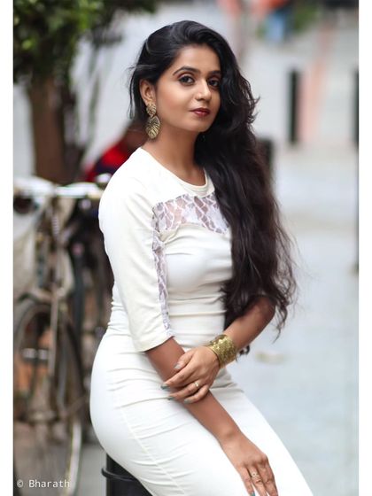 A classic urban portrait on a Bangalore street. The blurred background with a bicycle adds a touch of local character.