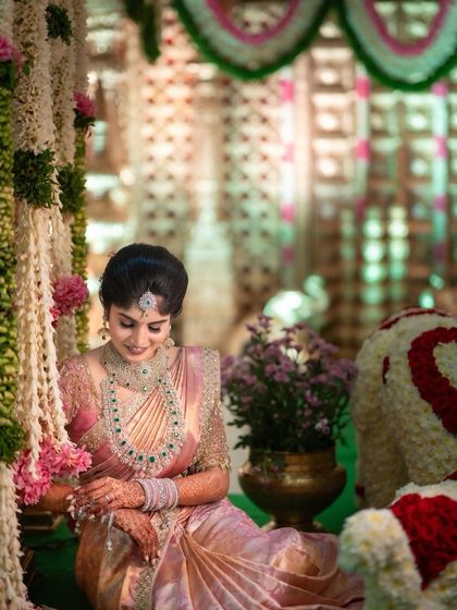 This bride's pastel pink engagement saree is pure elegance. The professional photos highlight how the drape complements the decor and the couple's style, looking perfect from every angle.
