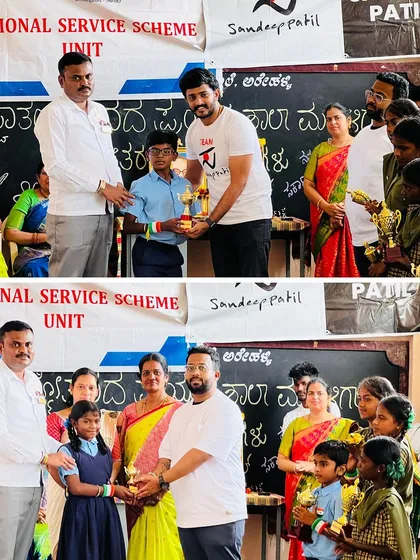 Awarding trophies to young winners of the art competition. Encouraging healthy competition and recognizing achievement is key to building confidence in children.
