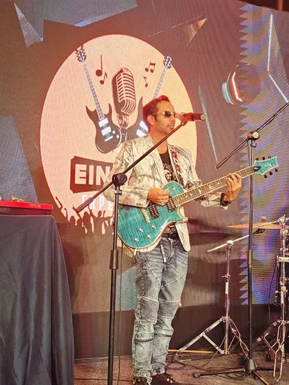 Our lead singer on stage during a corporate performance for State Bank of India at The Oterra Hotels.