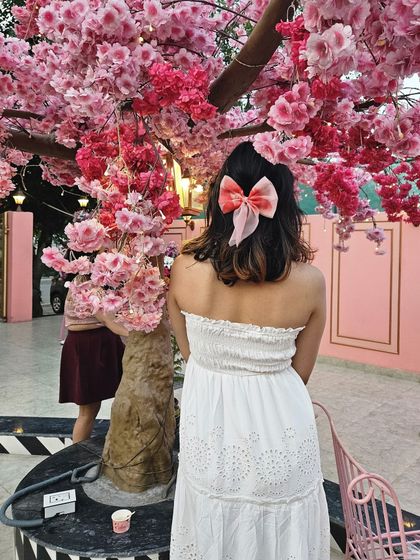 Even the back of your outfit matters. I added a cute bow to my hair to complete this romantic, feminine look.