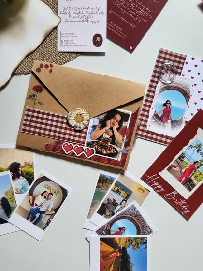 A beautifully arranged birthday hamper, with a custom envelope, photo cards, and other small keepsakes.