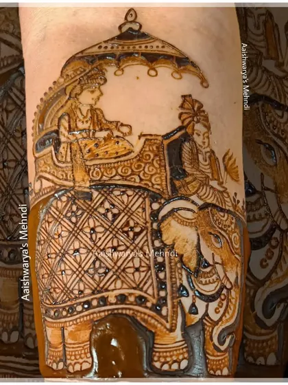 This design features a classic wedding scene of the bride and groom on an elephant. It's a majestic and traditional element that I love incorporating into full bridal designs for a royal feel.