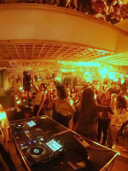 A fisheye lens captures the whole scene at Monkey Bar, a venue known for its old-school Bangalore vibes. I'm spinning retro and classic hip hop for a nostalgic night.