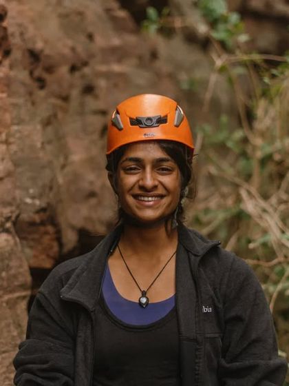 A portrait of our amazing event photographer. Our all-women crew includes talented individuals who help us capture and share our story.