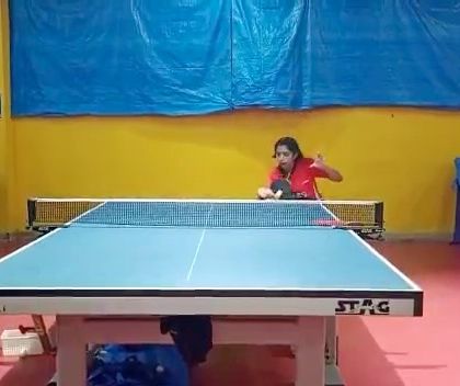 An action shot of Yashaswini during a match at the Youth National Championship.
