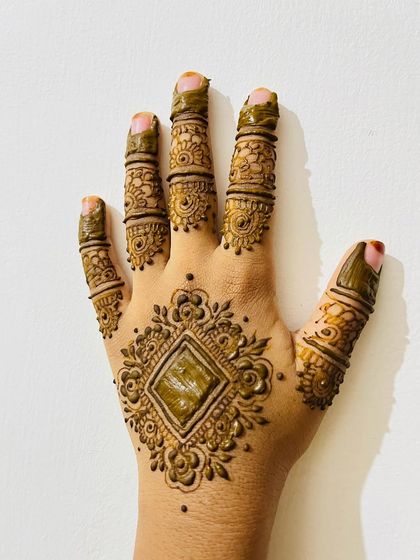 A mother-daughter twinning design, with a central diamond motif surrounded by flowers.