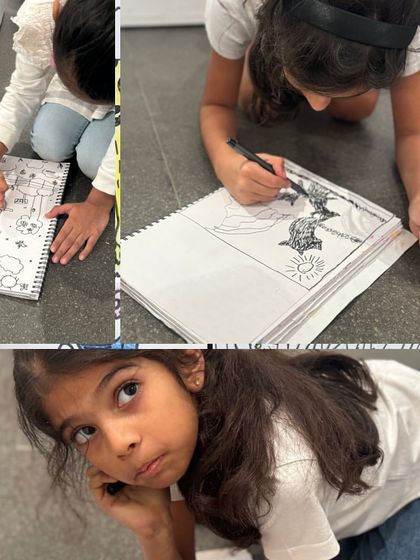 Young students are fully absorbed in their drawings during a visit to a wildlife photography exhibition. This shows how we use real-world inspiration to spark their creativity.