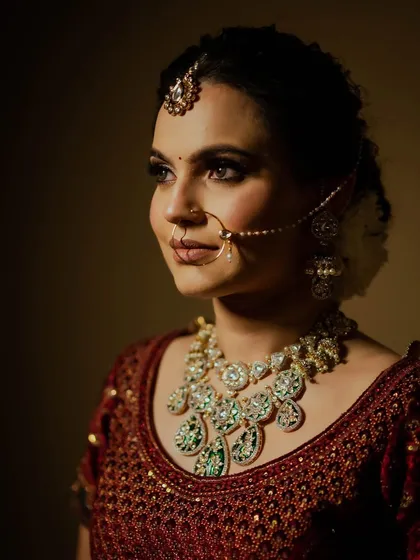 Shubhangi's wedding photos. I created a soft, romantic look with a messy braided bun and flawless makeup that lasted all night.