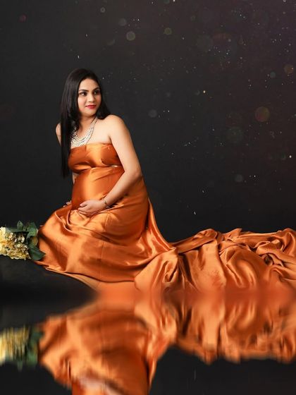 This portrait focuses on appreciating the beautiful changes of pregnancy. The mom-to-be is captured in a reflective pose, with a starry overlay adding a touch of magic to the scene.