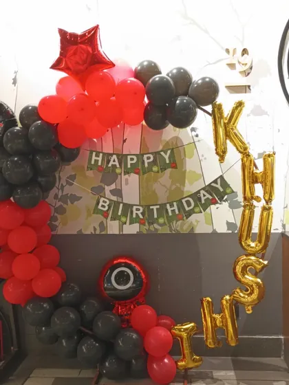 For fans of the hit show, we offer a 'Squid Game' theme decoration. This setup uses the iconic red and black color scheme with character balloons and a custom birthday banner.