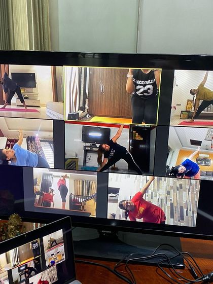 This picture captures the variety in our classes. You can see students in different stretching and strengthening poses like Triangle Pose. I always offer modifications so everyone can participate at their own level.