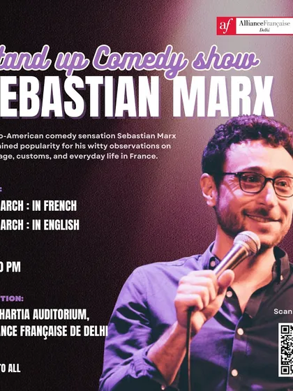 Franco-American comedian Sebastian Marx on stage during his stand-up show. Our auditorium hosts a variety of performances, including comedy nights in both French and English, bringing laughter and cross-cultural humour to our community.