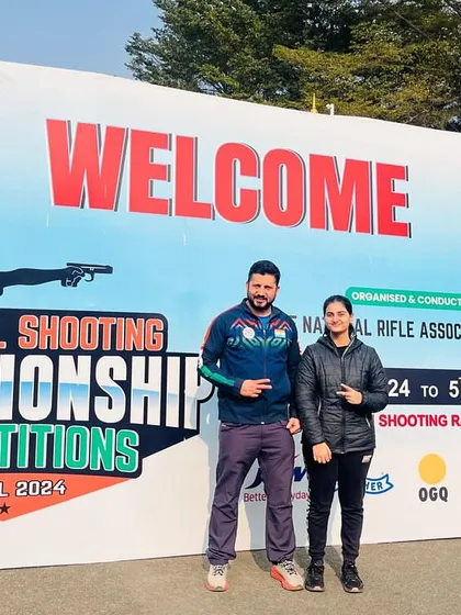A proud moment with junior national champion Niyamicka at the 67th National Shooting Championship. My goal is to turn promising young shooters into national champions.