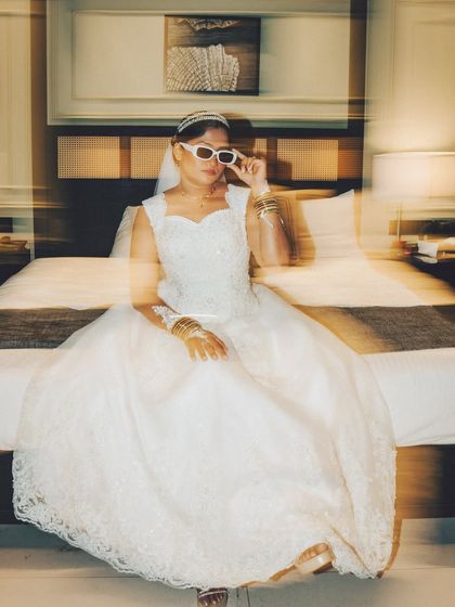 A creative bridal portrait with a double exposure effect. This artistic shot is modern and adds a dynamic, edgy feel to the collection.