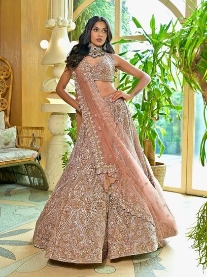 Who wouldn't want to shine on their wedding day? This bespoke reception look features a smoky eye and nude lip, paired with voluminous waves for a glamorous evening style.