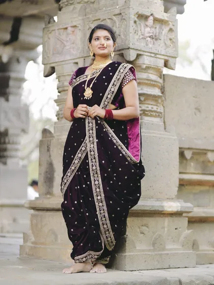 Celebrate your heritage with grace. My collection includes stunning traditional wear like this deep purple velvet Navari saree, perfect for a culturally rich and elegant pre-wedding shoot.