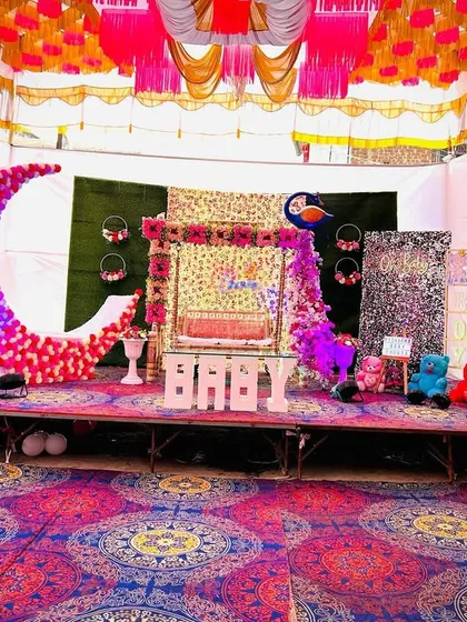 Another angle of the grand Dohale Jevan stage, showing the colorful pandal ceiling and the complete arrangement of props and decorations.