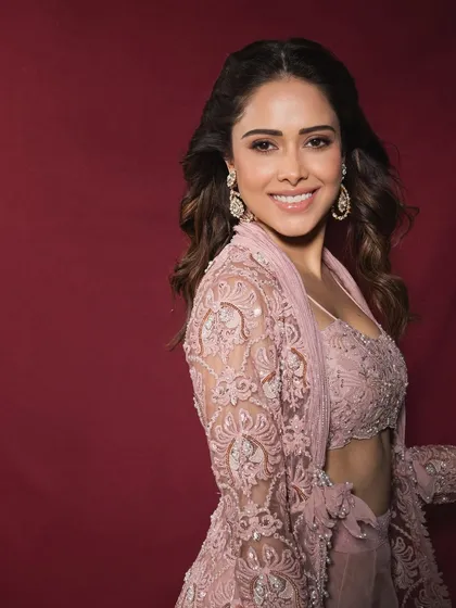For Nushrratt Bharuccha, we created this dreamy pastel indo-western look, perfect for a sangeet or a daytime wedding. The delicate lacework and modern silhouette show how to blend traditional crafts with contemporary style.