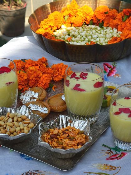 A festive Holi spread featuring thandai and snacks served in my elegant silver-finish bowls and trays.