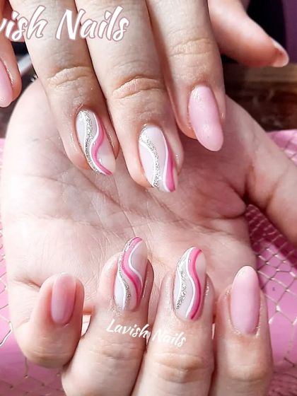 A delicate swirl design in pink and white, highlighted with a fine line of silver glitter.