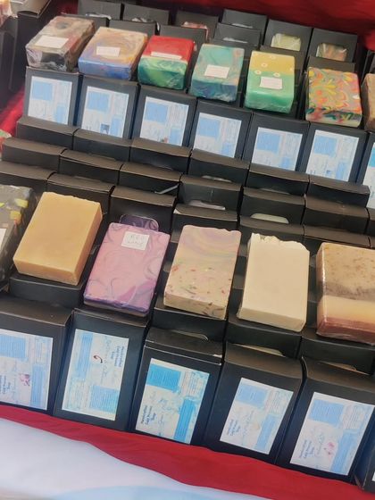 A close-up of my cold process soap display. I have them in boxes, ready to go, with a few samples out so you can see and smell them.