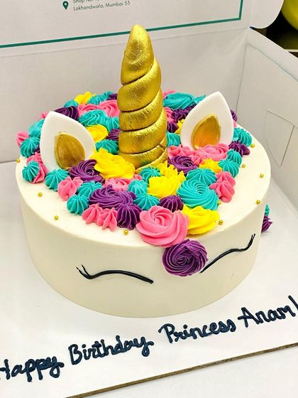 A classic unicorn cake design with a golden horn and a mane of colorful buttercream swirls. This theme is always a favorite for kids' birthdays.