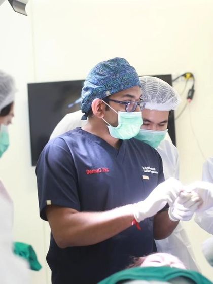 I am demonstrating a specific surgical technique to an attentive group of doctors during the FUEASIA ASEAN Regional Workshop in Bangkok. These close-up sessions are crucial for learning fine motor skills.