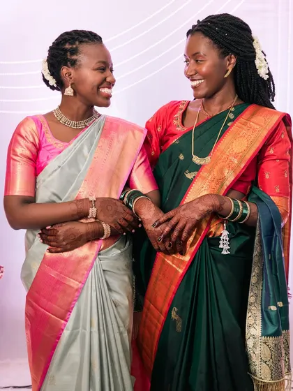 Celebrating all kinds of love and family bonds. This beautiful, candid moment between sisters at a cross-cultural wedding is full of warmth and genuine smiles.