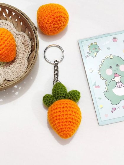 A cute and simple carrot charm keychain, perfect for a touch of whimsy.