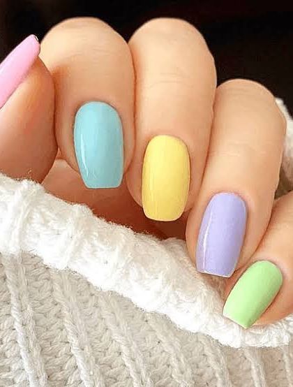 A simple yet festive look for Holi. This set features a solid coat of beautiful pastel shades on each nail, like a handful of colorful gulal.