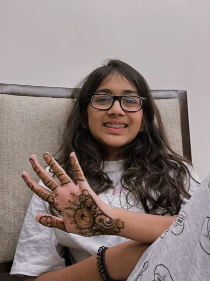 It's always fun to apply henna on young hands! A cute and simple design for a happy client.