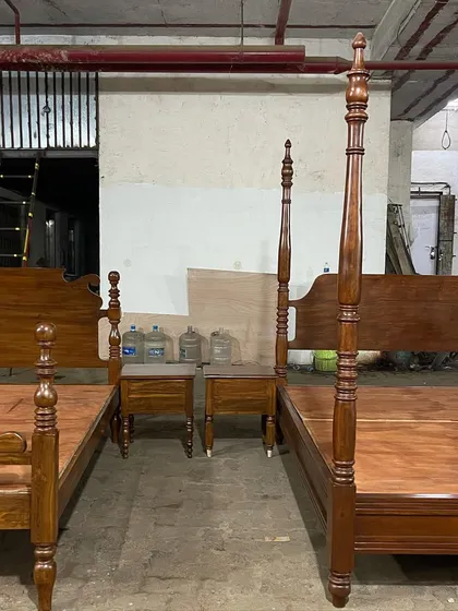 Two different styles of four-poster beds side-by-side in my workshop.