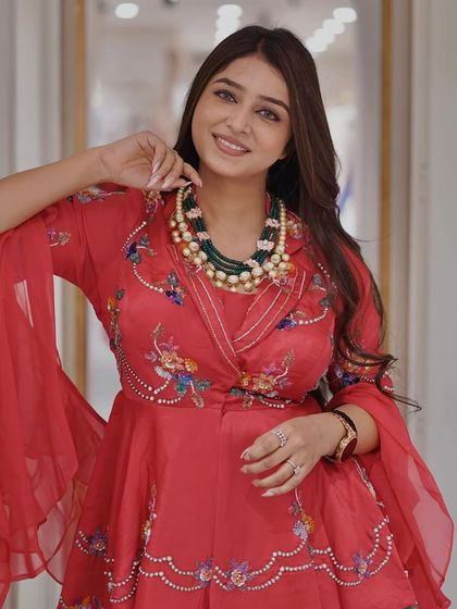 Shine bright this festive season in this stunning red blazer and palazzo suit set, blending modern elegance with traditional charm.