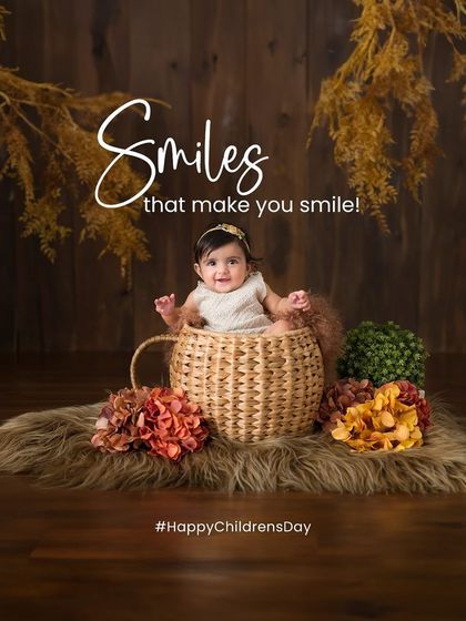 Smiles that make you smile. This little one, sitting happily in a basket, shows off the kind of heartwarming smile I love to capture.