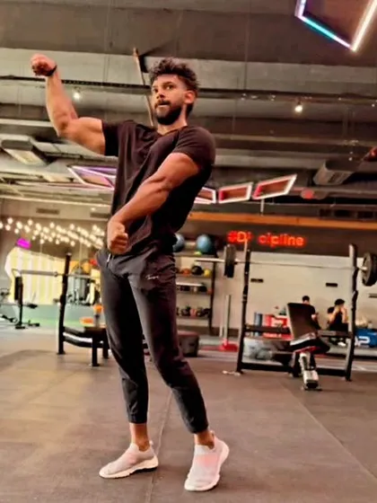 A classic bicep pose. Simple but effective for showcasing arm development and peak.